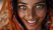 © Jolanta - Close-up portrait of a smiling South Asian woman wearing traditional attire, highlighting her cultural beauty.