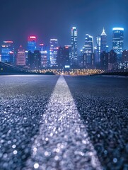 Wall Mural - city skyline is lit up at night with white line down middle of road