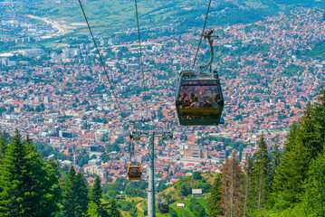 Wall Mural - Trebevic gondola raising from the old town of Sarajevo, Bosnia and Herzegovina