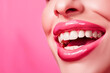 Close-up of pink glossy lips with white teeth, showcasing a bright, healthy smile. Copy space