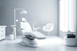 modern dental clinic interior featuring a dental chair with a lamp, side table, and bright natural light from the window.