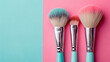 Set of makeup brushes on pink and aqua color, fashion concept, beauty industry