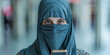 © smth.design - Serene Gaze: Young Woman in Hijab Holding Smartphone