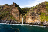 Fototapeta Natura - Waterfall fall into Atlantic Ocean in Madeira Island, Portugal. Aerial Drone view
