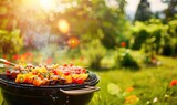 Fototapeta Uliczki - Vibrant image of grilled kebabs with a variety of vegetables and meats on a smoking barbecue in a garden.