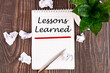 © Iryna - Lessons learned text concept written in a notebook with pen, top view.