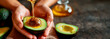 Natural wellness concept, a hand holding a ripe avocado with honey drizzling on it, symbolizing organic and nourishing skin food in a homely atmosphere. Banner. Copy space