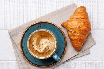 Canvas Print - Cappuccino coffee and fresh croissant