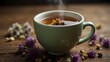 A close- up shot of a steamy cup of herbal tea surrounded by dried flowers
