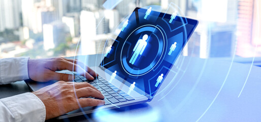Poster - man hands typing in laptop computer, human resourcse icons in glowing circle