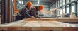 Two carpenters working together in an industrial wood factory, focusing on precision in craftsmanship