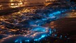 blue bioluminescent water waves at the beach. 