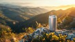A tranquil scene featuring a beverage can on a rocky outcrop, bathed in the warm light of a setting sun over rolling hills. Product Mockup Concept