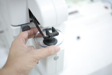 close up of a hand holding a lens eyeglasses 