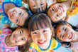 Bunch of cheerful asian joyful cute little children playing together and having fun.