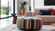 contemporary ottoman clothed in eye-catching, wide-striped fabric, serving both as a functional piece and a bold accent in a modern living space