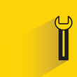 wrench icon with shadow on yellow background