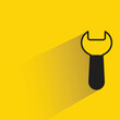 wrench icon with shadow on yellow background