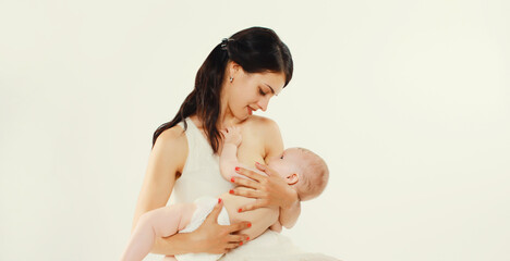 happy mother breastfeeding her baby on white background