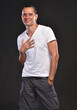 Handsome man in white T-shirt posing in studio