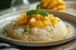 Mango sticky rice served on white plate