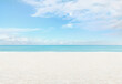 Panoramic view of the beach with turquoise sea sands and a sunlit azure sky with clouds. Banner with copy space for summer beach holiday getaway in idyllic location, booking travel and resort stays