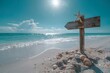 A wooden arrow-shaped directional sign decorated with starfish standing on a white sand beach