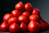 Fototapeta Konie - Heap of red, fresh, aromatic, ripe tomatoes with water drops on a dark background