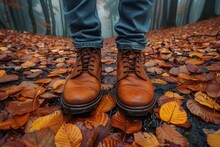 Polished Brown Leather Boots On A Bed Of Autumn Leaves Portraying A Sense Of Exploration And Style