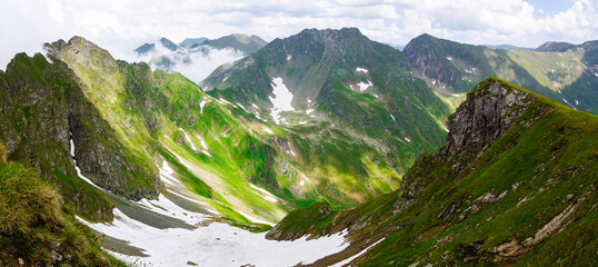 Wall Mural - spectacular view from above of a valley in fagaras mountains. mountainous landscape of romania in su