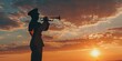 A man in a military uniform is playing a trumpet in front of a beautiful sunset. Concept of pride and patriotism, as the man's instrument symbolizes the strength and unity of the nation