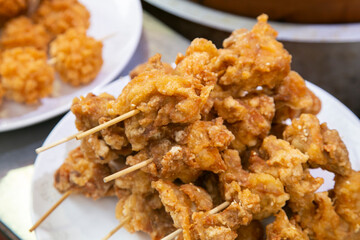 Wall Mural - Chinese fried chicken balls in a street food stand in Kobe, Japan.