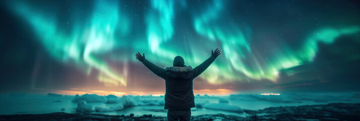 Wall Mural - happy male traveler on the background of bright colorful polar northern lights in night starry sky w