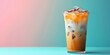 Iced caramel latte, macchiato, coffee with whipped cream and caramel syrup in glass with ice cubes on pastel colorful background, copy space