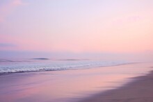 A Beach With Powerful Waves Crashing Onto The Shore, Creating A Dynamic Scene, A Serene Beach At Dawn With Pastel Hues, AI Generated