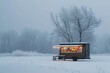 A small house covered in snow with lights shining through the windows on a winter evening, A small food truck in a winter landscape, AI Generated