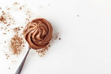 Wall Mural - Top view of white background with chocolate cream on spoon