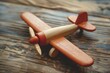 Wooden toy airplane on vintage wood background Educational plaything for young children
