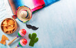 Cinco de Mayo holiday background made from maracas, mexican blanket stripes or poncho serape and hat on blue background.