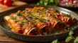 closeup baked enchiladas in plate, Mexican food concept, homemade tortilla with meat filling