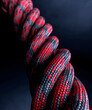 Twisted patterned red climbing rope close up 3d render