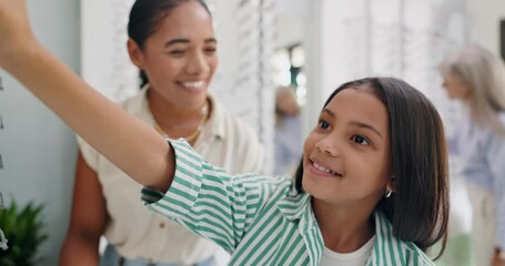 Canvas Print - Optometrist, child and mother for glasses in store with check, choice and decision for frame style with eyesight problem. Mom, girl and customer or shopping for spectacles or eyeglasses at eye clinic