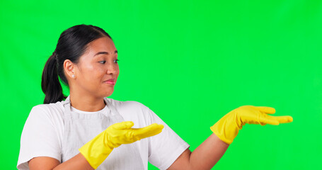 Canvas Print - Cleaning, presentation and pointing with woman on green screen for idea, choice and decision. Advertising, hygiene and show with portrait of person on studio background for offer, opinion and mockup