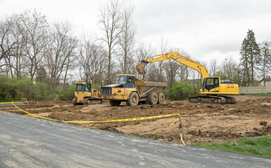 Wall Mural - Excavated Construction Site with Heavy Machinery