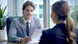 © PhotoPhreak - Handsome Young Male Employer in Professional Dialogue with Female Employee