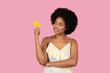 © Prostock-studio - African American woman thinking and holding credit card