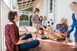 © Marko Geber - Boy playing soccer with family on the home porch