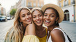 Three young women taking selfie portrait on city street - Multicultural female friends having fun on vacation hanging outdoor - Friendship and happy lifestyle concept,isolated on city blur background.