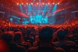 Fototapeta Zwierzęta - Back view of a person with an audience enjoying a live show with radiant stage lighting and engaging atmosphere.