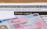 Fototapeta Londyn - An official poll card for government elections and a UK photo driving licence as prove of identity.